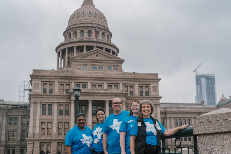 Texas nonprofit professionals in front of the Texas State Capitol